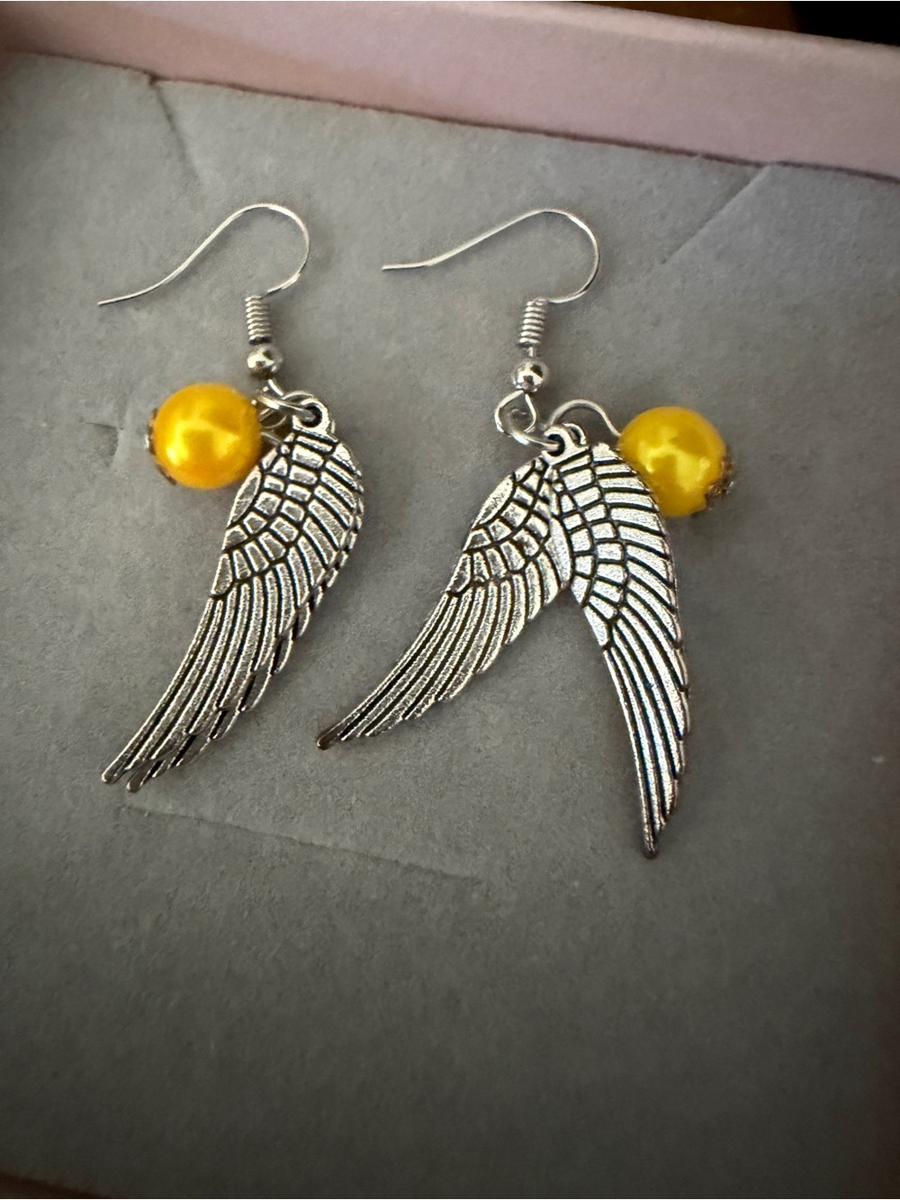 Silver Angel Wing Earrings with Yellow Bead